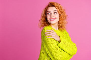 Photo of lovely cute dreamy girl wear stylish green clothes hug herself empty space isolated on vivid pink color background