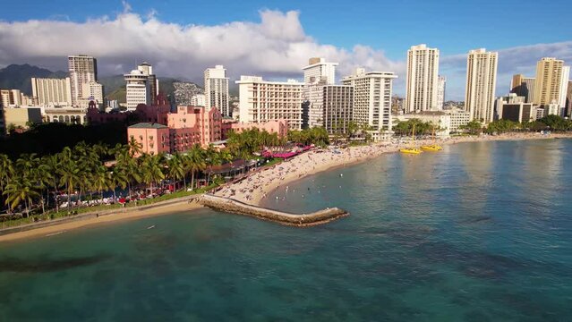 WAIKIKI - 3.19.2024 - Very good aerial footage moving from the ocean to the beach in Waikiki, Hawaii.