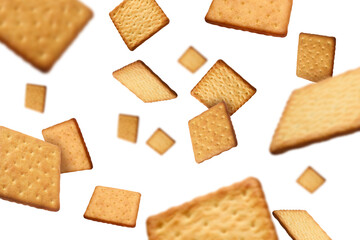 Tasty dry square crackers falling on white background