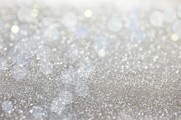 Shiny silver glitter as background. Bokeh effect - obrazy, fototapety, plakaty
