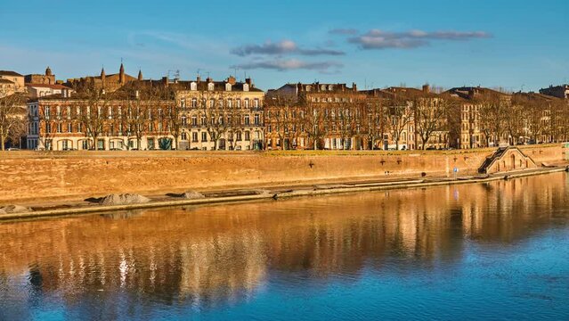 Timelapse Tounis wharf is street in Toulouse, France on edge of Garonne from Pont-Neuf, at corner of Rue de Metz and Quai de la Daurade, to Tounis towing bridge.