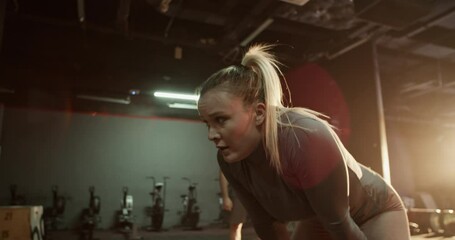Sportswoman taking break after intense workout at gym