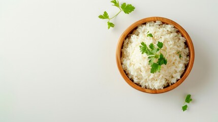 Healthy food. Wooden bowl with parboiled rice on white background. Top view, copy space, high resolution product.