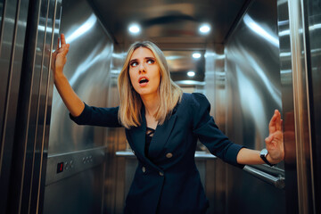 Stressed Businesswoman Feeling Uncomfortable and Anxious in Elevator. Worried lady having a panic attack alone in a lift 

 - obrazy, fototapety, plakaty