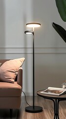 Modern LED table lamp, with a simple design featuring a black metal base and circular shade It provides low, cozy