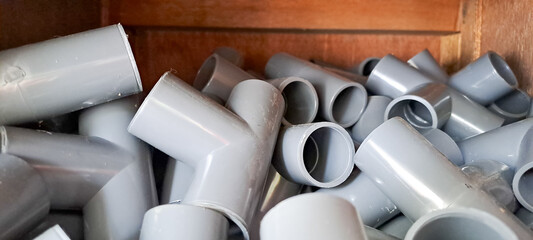 PVC pipe with thread, Coupling for pipes, Pipe fitting. Pumping compressor pipes on a white...