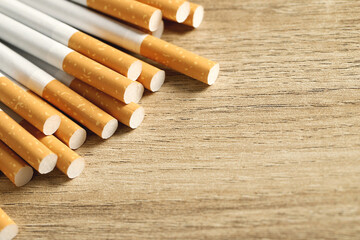 image of several commercially made pile cigarette on wood background. or Non smoking campaign...
