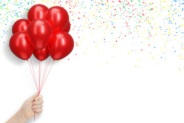 Female hand holding bunch of shiny red balloons on white background with confetti. Empty space for...