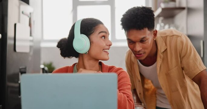 Couple, laptop or smile with headphones in kitchen for food vlogging, content creation or upload of meal video. Gen z influencer, people or support with editing skills, preparation or talking in home