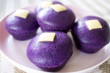 Obraz na płótnie Canvas Ube Puto is a delicious Filipino steamed rice cake purple yam usually eaten as a snack or dessert