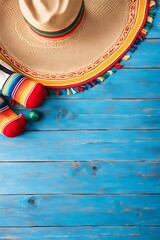  Mexican background serape striped blanket with sombrero maracas on old blue wood floor Mexico Cinco de mayo festival vacation photo 