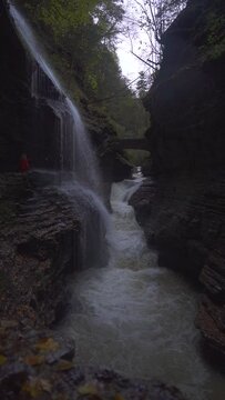 Vertical Video - Girl Walks Scenic Path Waterfall Watkins Glen