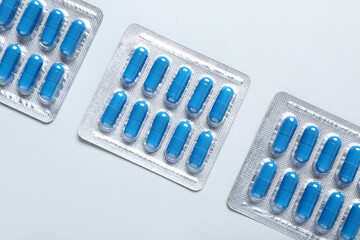 Blister packs with pills on white background