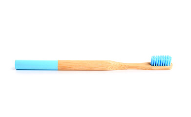 Wooden toothbrush on white background