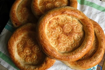 Beautiful flatbreads in close-up. Flatbread is the main type of bread in Central Asia. Delicious, fragrant bread.