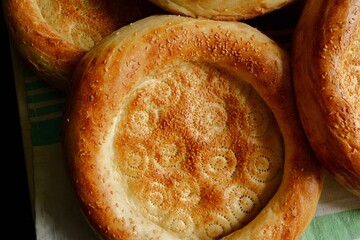 Beautiful flatbreads in close-up. Flatbread is the main type of bread in Central Asia. Delicious, fragrant bread.