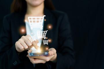 Woman touching on hologram shopping cart icon on mobile application.