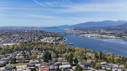 Skyline of Burnaby, Vancouver, and the Burrard Inlet in the Lower Mainland during a spring season in British Columbia, Canada