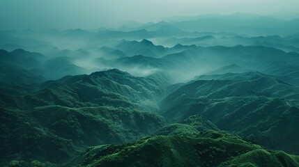 view of the green mountain ranges from above, in the style of mysterious backdrops, uhd image - obrazy, fototapety, plakaty
