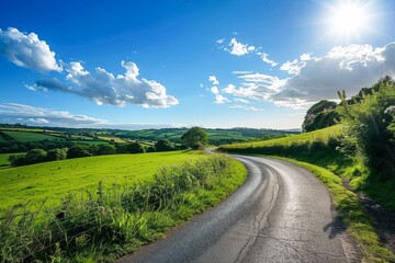 Sunny Day Over a Curved Country Road in a Lush Green Landscape