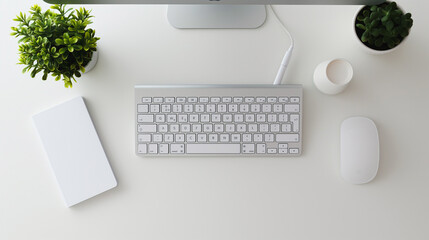 A white computer keyboard sits on a white desk with a mouse and a notebook