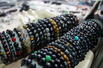 Bracelets made of natural stones: agate, volcanic lava and obsidian.