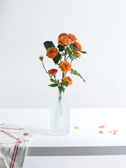 A bouquet of Valentine's Day roses on a white tabletop