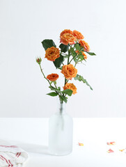 A bouquet of Valentine's Day roses on a white tabletop