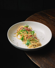 A delicious serving of spaghetti Bolognese: perfectly cooked pasta topped with rich, savory meat sauce. This classic Italian dish features a hearty blend of ground meat, tomatoes, and aromatic vegetab