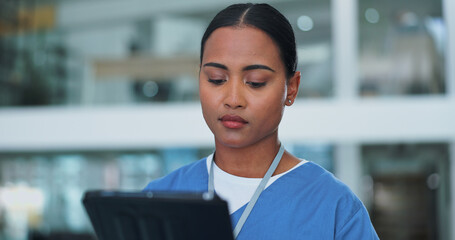 Nurse or black woman, tablet and browsing in hospital for online research, medical solution and telehealth for diagnosis. Healthcare, worker and tech for information, results and work with internet