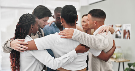 Group therapy, counseling and people hug in rehabilitation center for support, empathy or...