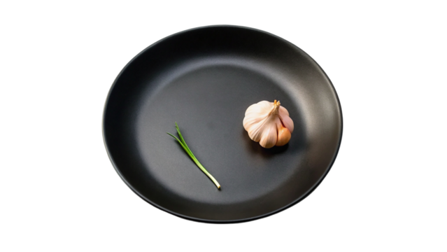 Garlics on black plate isolated on transparent background