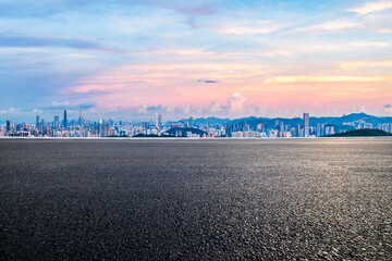 Asphalt road and city skyline with modern buildings scenery at dusk in Shenzhen. panoramic view.