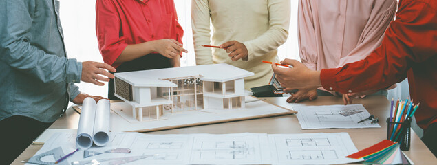 A cropped image of professional interior design team discuss about house material while smart...