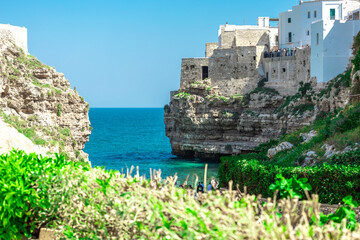 Polignano a Mare, beautiful city with a beach between the city cliffs. Colorful picture of a...
