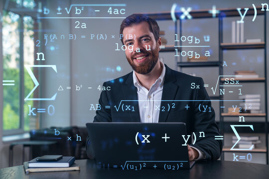 Smiling businessman in formal wear working on laptop at office workplace with smartphone and notebooks. Concept of successful business deal, agreement. Education icons. - Powered by Adobe