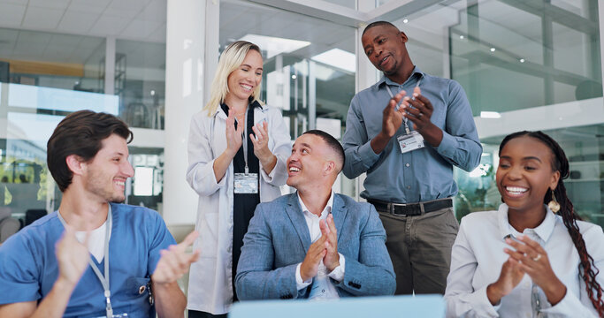Doctor, team and clapping hands for celebration in meeting for medical breakthrough and healthcare discovery. Medicine staff, nurse and people with applause, happy and diversity in conference room - Powered by Adobe