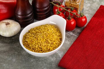 Dry wheat bulgur cereal heap