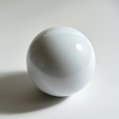 A single white glossy sphere sits on a plain light surface casting a soft shadow, depicting simplicity and purity.