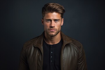 Obraz premium A man with a beard and a black shirt and a brown jacket