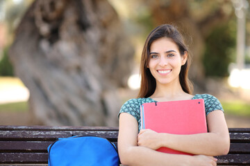 Student posing looking at camera in a park - 785030324