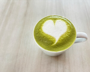 green tea with heart in cup