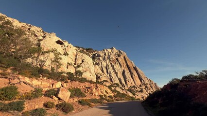 Exploring the Mediterranean terrain bathed in sunlight and dry climate, seizing a moment along the Spanish coast.