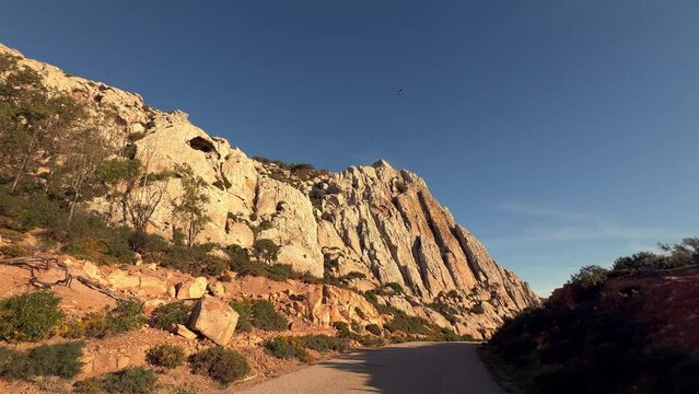 Exploring the Mediterranean terrain bathed in sunlight and dry climate, seizing a moment along the Spanish coast.