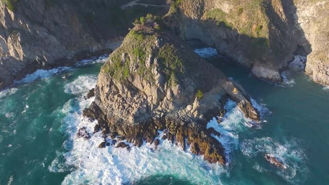 Drone footage of the Pacific Ocean waves crashing on Big Sur on California's central coast, USA