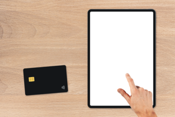 the tablet is on the wood table