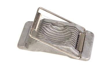 Very old egg cutter isolated