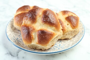 Hot cross buns on white marble table, closeup