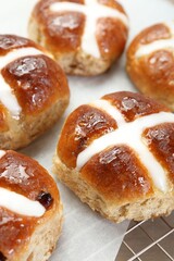 Tasty hot cross buns on table, closeup