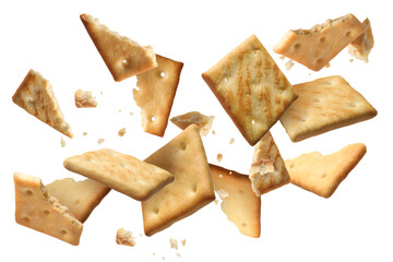 Tasty dry crackers falling on white background